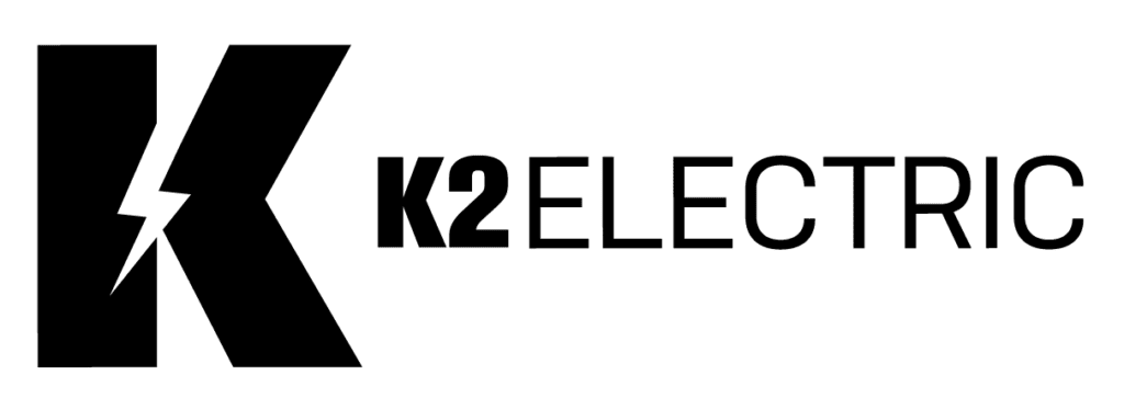 Logo of K2 Electric with a large black "K" featuring a lightning bolt inside, followed by the text "K2 ELECTRIC" in bold capital letters. The design is minimalistic and monochromatic, reflecting the cutting-edge energy solutions perfect for those pursuing careers in the electrical field.